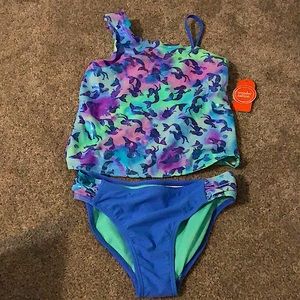 This swimsuit is 7/8 in kids from Walmart made by wonder nation and is unused.